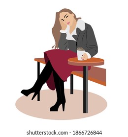 Beautiful young woman sitting at a table in a cafe. Stylish girl with coffee. Business woman looking forward to meeting.
