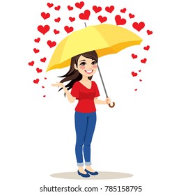 Beautiful young woman with yellow umbrella stopping raining hearts love concept