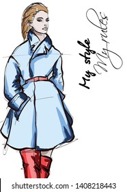 Beautiful young women in blue coat. Hand drawn fashion girl. Fashion model posing. Sketch. Vector illustration.