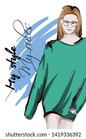Beautiful young women   in a green jersey. Hand drawn fashion girl. Fashion model posing. Sketch. Vector illustration.