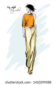 Beautiful young women in trousers and blouse. Hand drawn fashion girl. Fashion model posing. Sketch. Vector illustration.