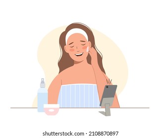 Beauty blogger. Cosmetics procedures tutorial video . Young woman takes care of her face and recording video.
