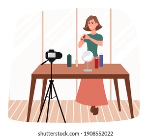 Beauty blogger. Pretty woman makes a review on cosmetics, records a video blog on the camera.
