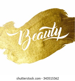 Beauty Gold Foil Lettering Poster. Typographical Vector Background. Handmade calligraphy. Gold watercolor texture paint stain abstract illustration. Shining brush stroke for you amazing design project