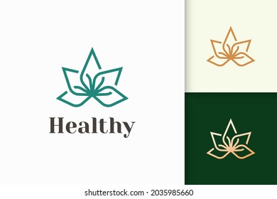 Beauty or health logo in flower shape fit for wellness or clinic