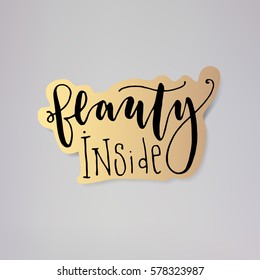 "Beauty inside" - vector illustration design of modern badge with text isolated on gold background. Creative sticker design.