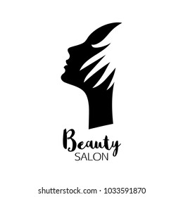 Beauty salon logo with woman head silhouette and hand. Hair care symbol.