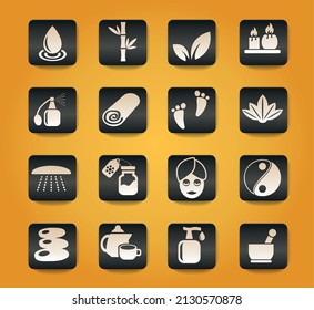 beauty and spa symbols on black buttons on yellow background