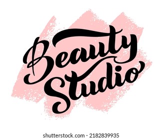 Beauty studio vector text, lettering. Black handwritten logo on a pink background. Stylish logotype for the beauty studio, business, salon.