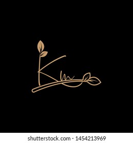 Beauty vector Initial letters K M with leaf. Signature, handwriting, fashion, boutique, wedding, jewelry, botanical , floral logo creative Vector logo Design template