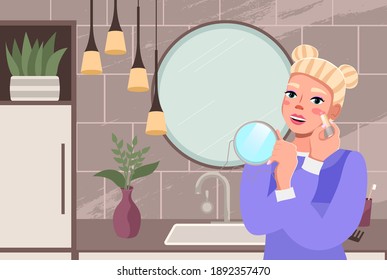 Beauty woman at dressing table in looking in the mirror and doing makeup. The girl applies blush. Makeup and beauty care routine concept. Female character is holding cosmetic product in hands