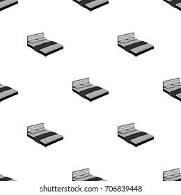 A bed with a back, pillows and a coverlet. Beds single icon in monochrome style vector symbol stock illustration web.