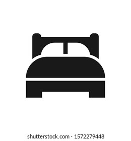 Bed with pillows simple black vector icon. Hotel or hostel symbol.