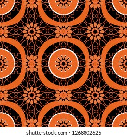 Bed sheets and interior. Seamless abstract vector geometric pattern. Gift wrapping paper. Colorful ethnic patterned background in white, orange and black colors. Symmetrical layout.