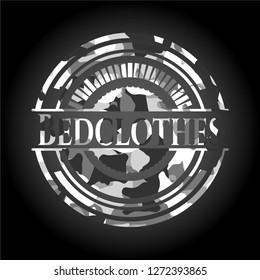 Bedclothes on grey camo texture