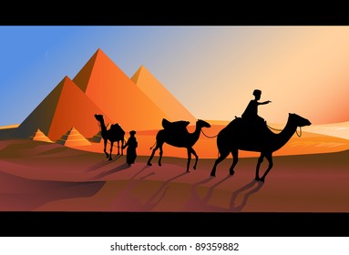 Bedouin caravan camels against over pyramids.