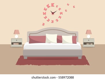 Bedroom in a beige color. There is a bed with pillows, bedside tables, lamps and other objects in the picture. There is also a big pink clock in a shape of butterflies on the wall. Vector illustration