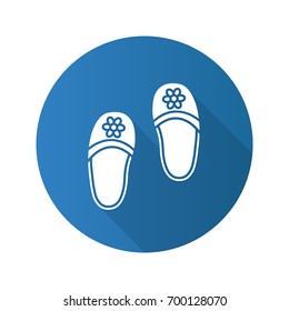 Bedroom slippers flat design long shadow glyph icon. Home shoes with flowers. Vector silhouette illustration