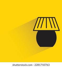 bedside lamp with shadow on yellow background