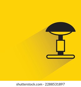bedside lamp with shadow on yellow background