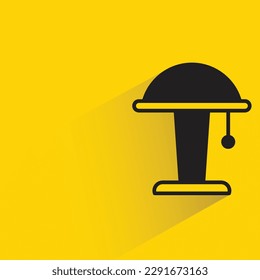 bedside lamp with shadow on yellow background