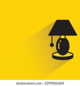 bedside lamp with shadow on yellow background