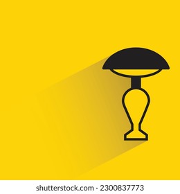 bedside lamp with shadow on yellow background