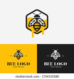 A bee and dripping honey inside a hexagon logo