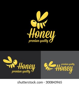bee logo. vector golden bee icon on black background. abstract bee silhouette