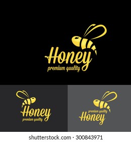 bee logo. vector golden bee icon on black background. abstract bee silhouette