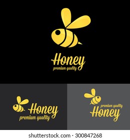 bee logo. vector golden bee icon on black background. abstract bee silhouette