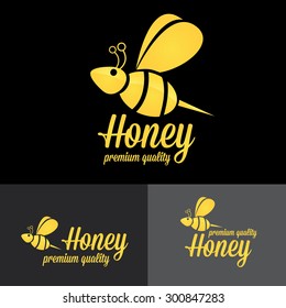 bee logo. vector golden bee icon on black background. abstract bee silhouette