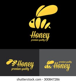 bee logo. vector golden bee icon on black background. abstract bee silhouette