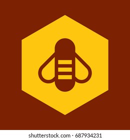 Bee on honeycomb on brown background