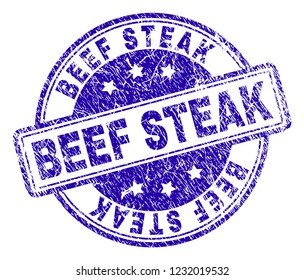 BEEF STEAK stamp seal imprint with distress texture. Designed with rounded rectangles and circles. Blue vector rubber print of BEEF STEAK text with unclean texture.