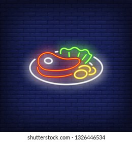 Beef steak with vegetables on plate neon sign. Meat cooking, dinner and restaurant concept design. Night bright neon sign, colorful billboard, light banner. Vector illustration in neon style.