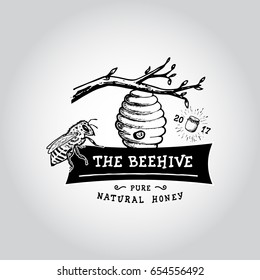 The beehive. Hand drawn bee, flower, hive, glass jar. Label logo template. Design fashion apparel print. Graphic vintage illustration.