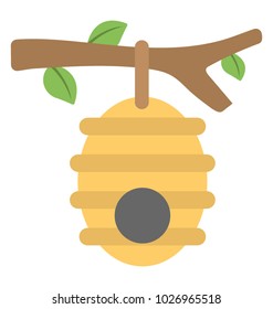 
Beehive in a tree branch with a circular entrance
