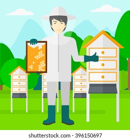Bee-keeper at apiary.
