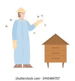 Beekeeper at apiary in protective suit and hat stands near hive and flying bees.