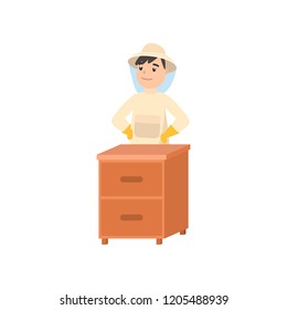 Beekeeper collects honey from bees. Beekeeper in a bee protection suit with a jar of honey.