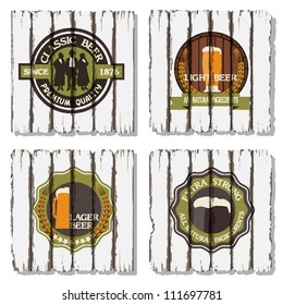 Beer badges and labels on wooden  background