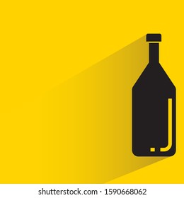 beer bottle with drop shadow in yellow background