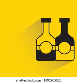 beer bottles with shadow on yellow background