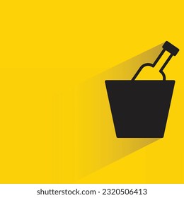 beer in bucket with shadow on yellow background