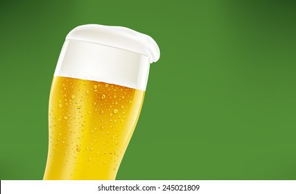 beer with foam and many fresh drops on green background