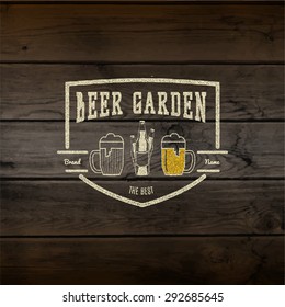 Beer garden badges logos and labels for any use, logo templates and design elements for beer house, bar, pub, brewing company, brewery, tavern, restaurant, on wooden background texture