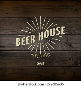 Beer house badges logos and labels for any use, logo templates and design elements for beer house, bar, pub, brewing company, brewery, tavern, restaurant, on wooden background texture