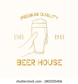 Beer house golden label, badge. Pub emblem with hand holding a glass with foam. Vector illustration with gold vintage brand design.