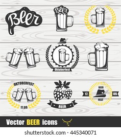 Beer icons set with Mug of Beer, wreath and Hop. Beer logotype. Vector illustration isolated on wood background. Icons for beer bar, menu or beer shop.